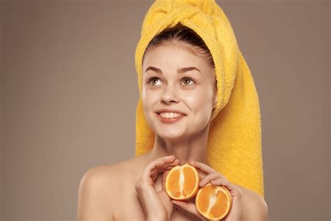 premium photo beautiful woman with naked body skin care mandarin in hand
