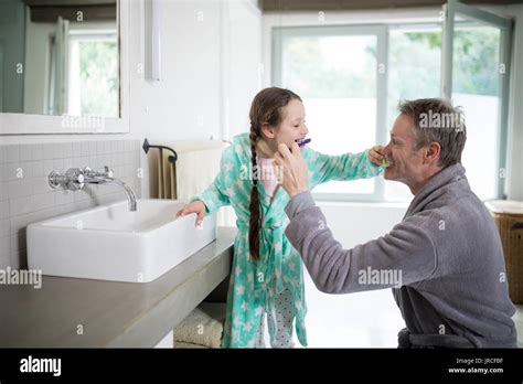 Father And Daughter Brushing Teeth In Bathroom Photo Getty Images My Xxx Hot Girl