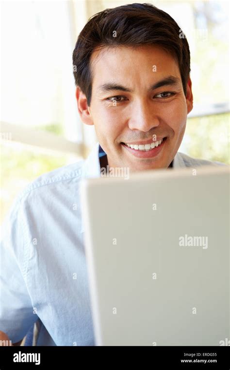 Filipino Man Working On Laptop Stock Photo Alamy