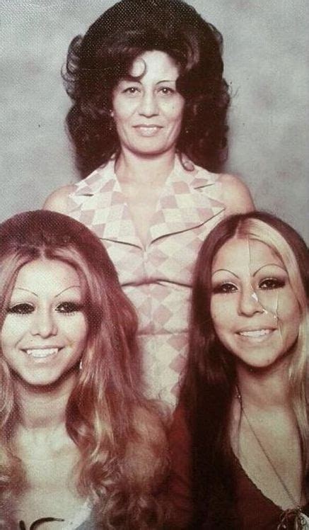 Three Women Are Posing For A Photo Together