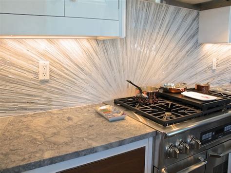The kitchen backsplash is placed on the kitchen wall between the countertops and the wall cabinets. 5 Modern And Sparkling Backsplash Tile Ideas - MidCityEast