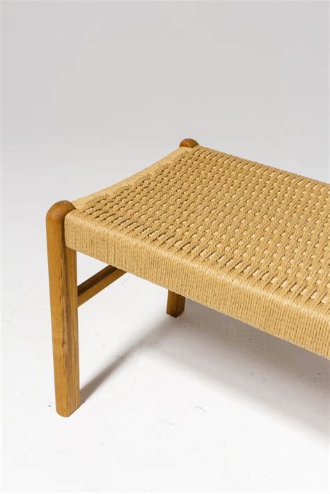 While you wouldn't want to spend hours sitting it has a gorgeous light natural weave that looks good anywhere. AB057 Chester Woven Rattan Bench Prop Rental | ACME Brooklyn