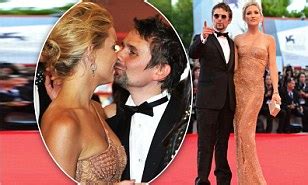 Kate Hudson puckers up to fiancé Matt Bellamy in a shimmering nude gown