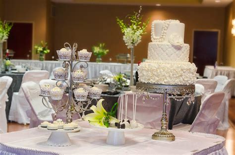 A wedding cake table is perhaps the focus of all attention and ought to look the best among all features at a wedding. Weddings | Aikens Group