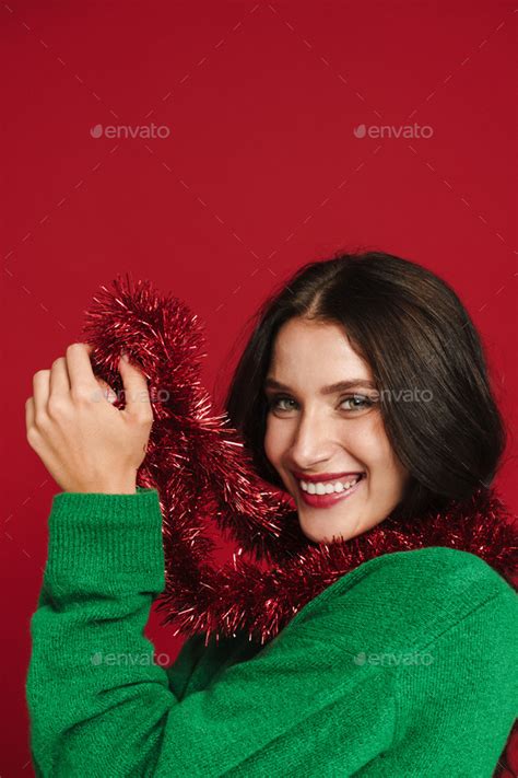 White Woman Laughing While Posing With Christmas Tinsel Garland Stock