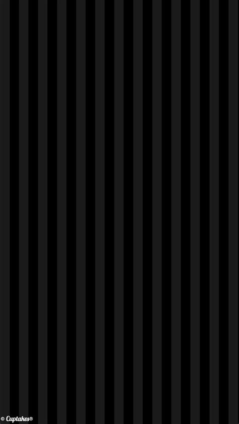 A Black And White Striped Wallpaper With Vertical Stripes
