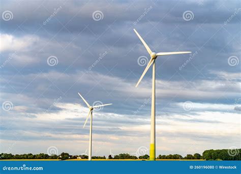 Group Of Wind Turbines Against A Blue Clouded Sky Stock Photo Image