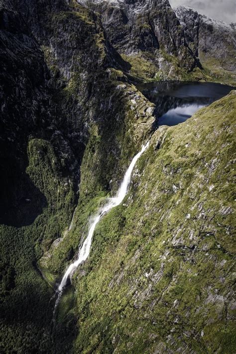 sutherland falls flowing from lake quill high up in fiordland [oc] [3456x5184] national parks