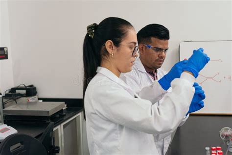 Laboratory Technicians Performing Chemical Tests Scientists Wearing