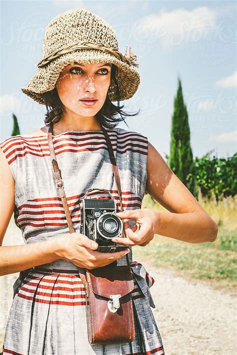 Old Fashioned Woman With A Retro Camera In The Italian Countrysi By Stocksy Contributor