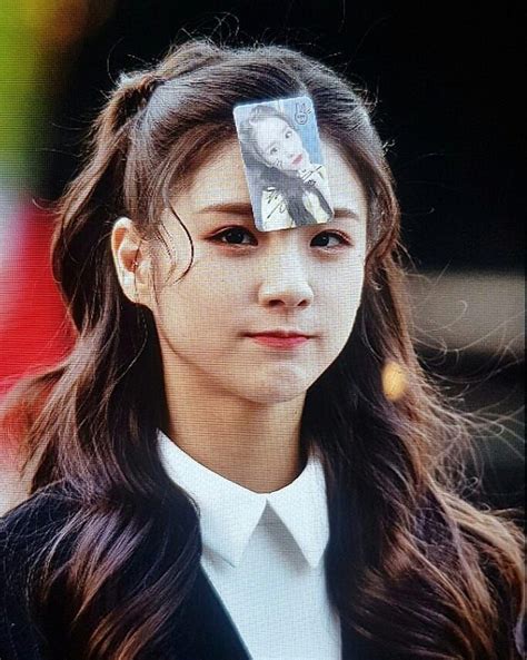 A Woman With A Piece Of Paper On Her Head
