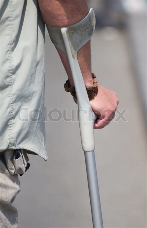 Male Hand Holding A Crutch In The Stock Image Colourbox