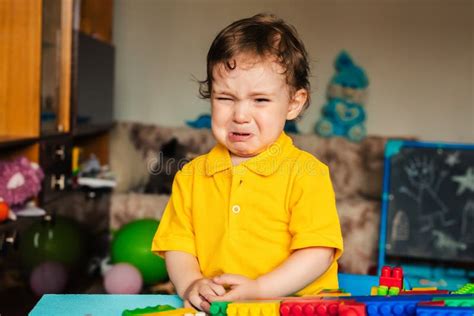 Sad Baby Boy Crying Next To Toys Stock Image Image Of Crying