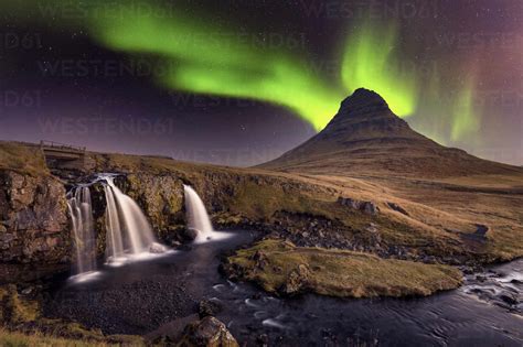 Aurora Borealis Northern Lights Over Kirkjufell Mountian With A Small