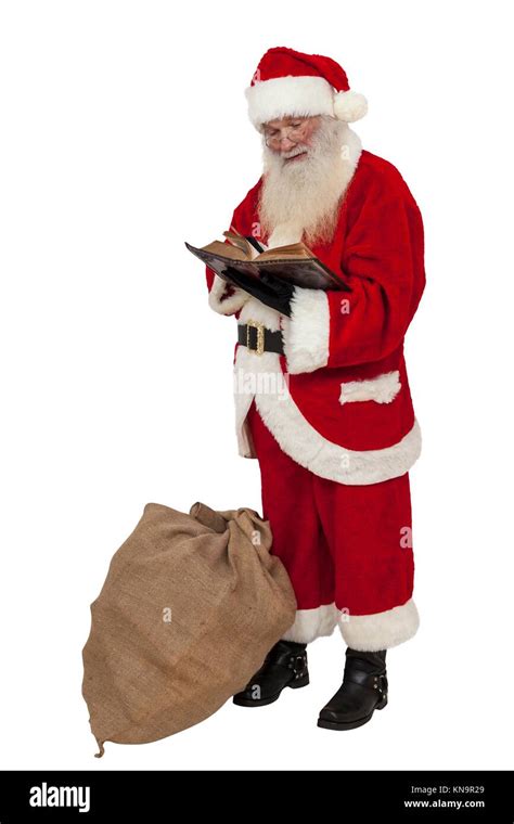Santa Claus Reading In A Book Isolated Stock Photo Alamy