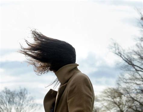 A Woman Has Her Hair Fluttering Extreme Weather Record Breaking