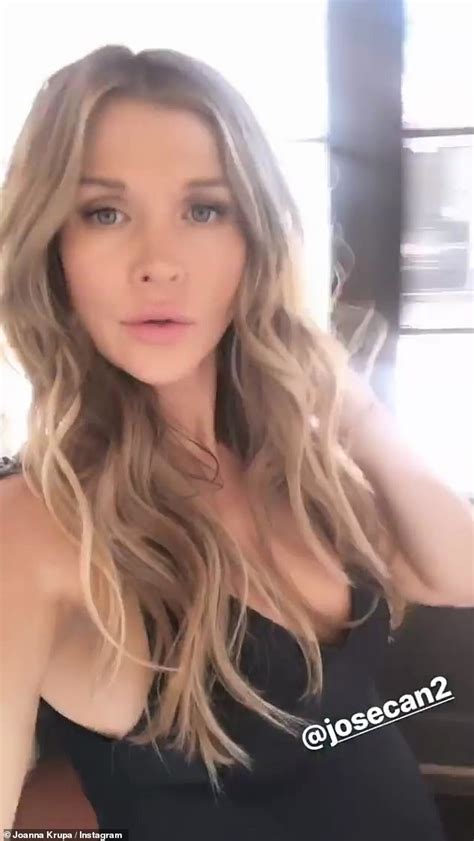 Joanna Krupa Rubs Her Baby Bump As She Works Swimsuit For Photo Shoot