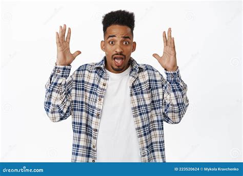 Shocked African American Guy Making Head Explosion Gesture Holding