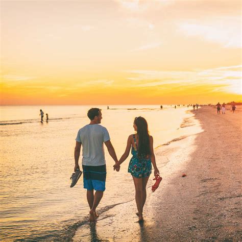 Loving Couple Walking Into Sunset At A Beach In Mexico Travel Off Path