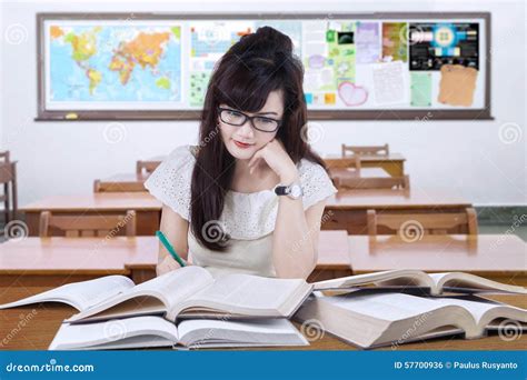 Female Learner Writing In The Classroom Stock Photo Image Of Portrait