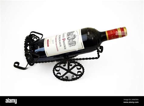 Cast Iron Wine Bottle Holder And A Bottle Of Calvet Prestige Bordeaux Cabernet Sauvignon Stock