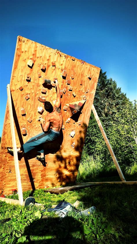 My Man On His Homemade Bouldering Wall Diy Climbing Wall Climbing