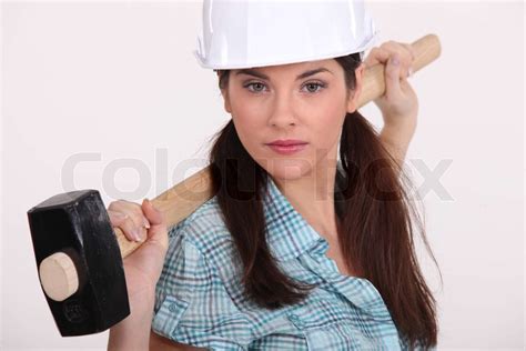 woman holding hammer stock image colourbox