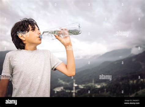 Thirsty Boy Drinking Water From Bottle Stock Photo Alamy