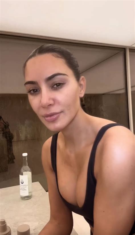 Kim Kardashian Flaunts Her Tiny Waist As She Removes Her Top In A New Video Captured In The