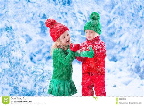 Kids Playing In Snowy Winter Forest Stock Photo Image Of