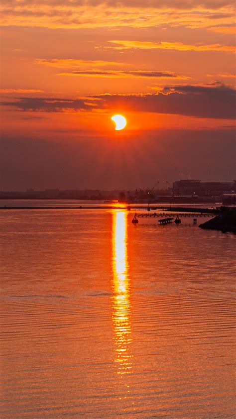 Download Wallpaper 2160x3840 Sun Sunset Water Pier Landscape