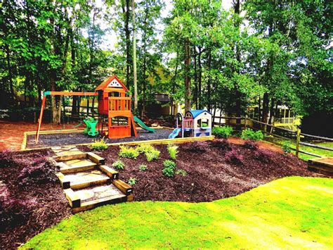 Tea olives were planted along the side and large hollies along the back property. Sloped Backyard Landscaping Ideas On A Budget To Landscape ...