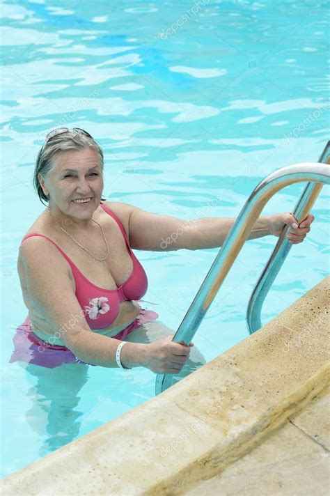 Elderly Woman In Swimming Pool Stock Photo By Aletia