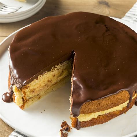 Boston cream pie and chocolate sheet cake with milk chocolate frosting. National Boston Cream Pie Day — Why We Celebrate