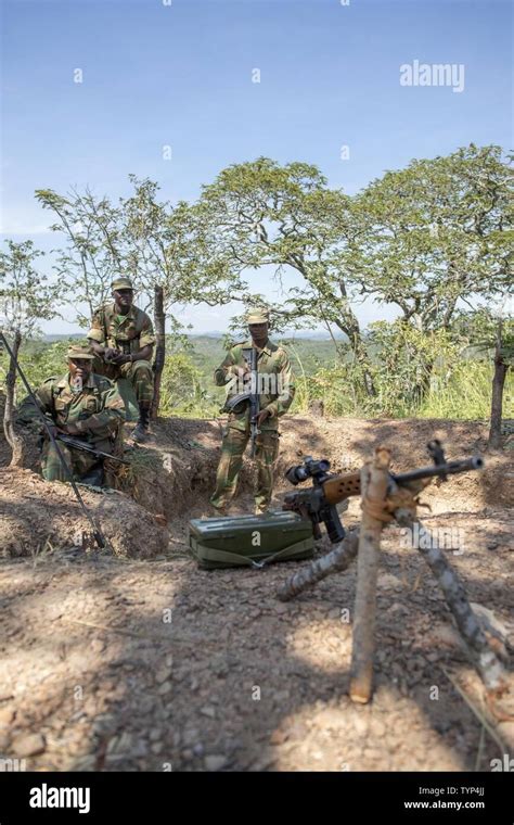 Zambian Soldiers Guard The Perimeter Of Their Outpost From A Foxhole