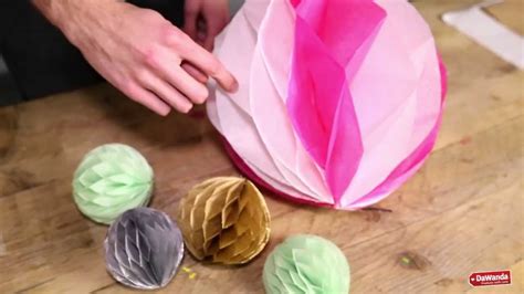 Learn how to make pom poms from yarn. Honeycomb Pom Pom DIY tutorial - YouTube