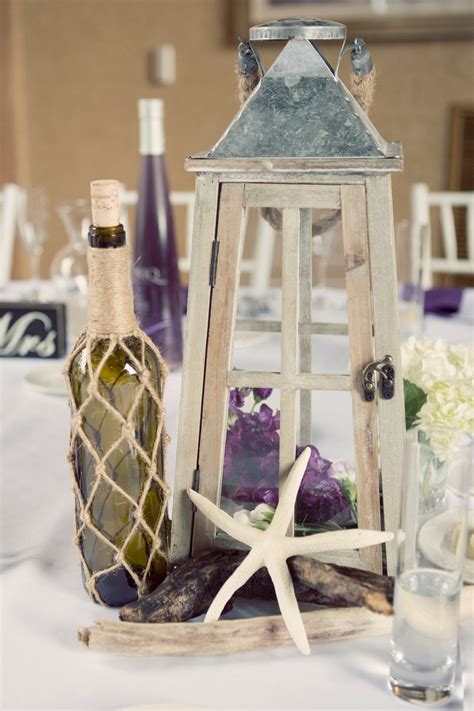 Consistent With The Nautical Theme The Diy Centerpieces Included Wine Bottles Wrapped In Twine