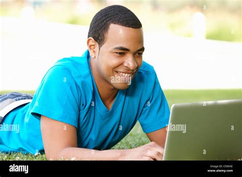 Young Man Using Laptop Outdoors Stock Photo Alamy