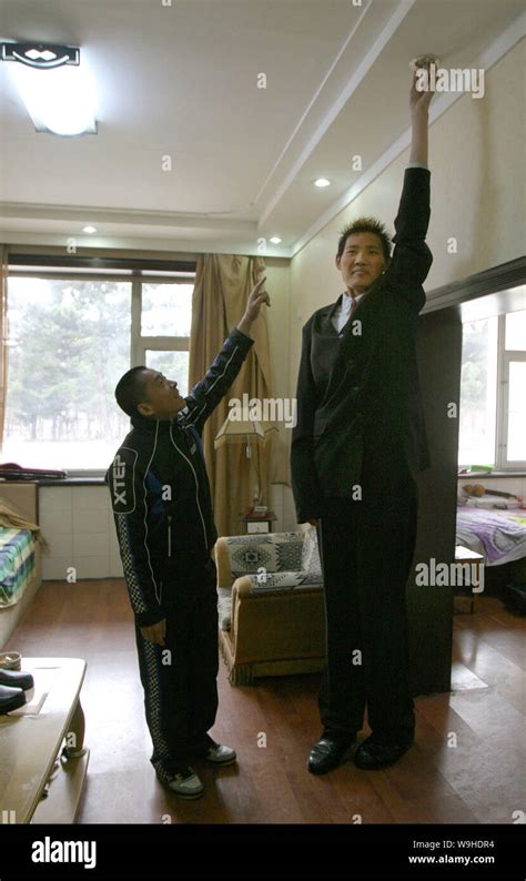 Photo Shows Zhao Liang Who Is 23 Years Old 24 Meters Tall And Still Growing Touches The