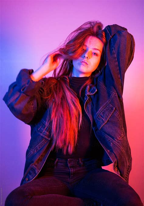 Vibrant Studio Portraits Of A Young Woman With Pink And Blue Lighting