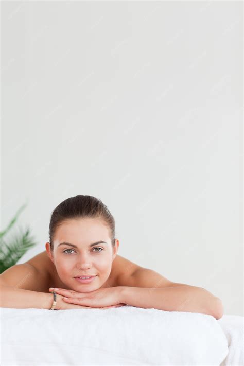 Premium Photo Portrait Of A Brunette Lying On A Massage Table