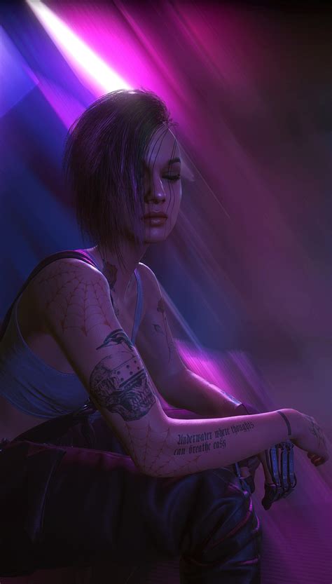 A Woman With Tattoos Sitting In Front Of A Purple And Blue Background