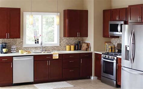 A Kitchen With Cabinets In A New Dark Wood Finish Affordable Kitchen
