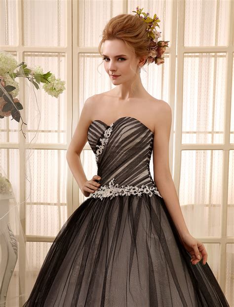 It is strapless and has a sweetheart neckline. Black Wedding Dress Beading Ball Gown Floor-Length with ...