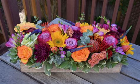 Colorful Long And Low Table Centerpiece With Lots Of Floral Goodies T Box Handcrafted By Fl