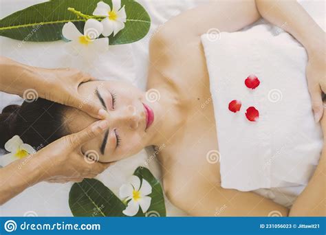 Masseur Doing Massage The Head Of An Asian Woman Stock Image Image Of Medical Female 231056023