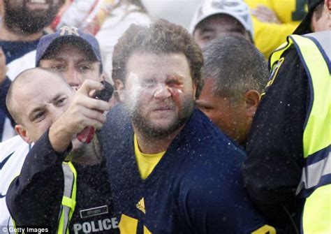Police Officer Pepper Sprays Handcuffed Michigan Football Fan Daily