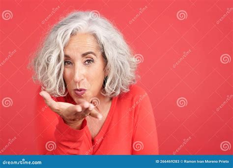 close up of a woman blowing a kiss to the camera stock image image of positive cheerful