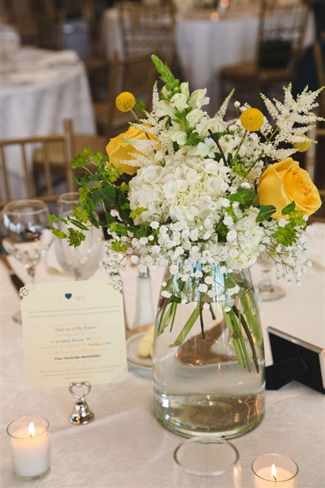 White and Yellow Centerpieces | Yellow centerpieces, Yellow flower centerpieces, Yellow wedding ...