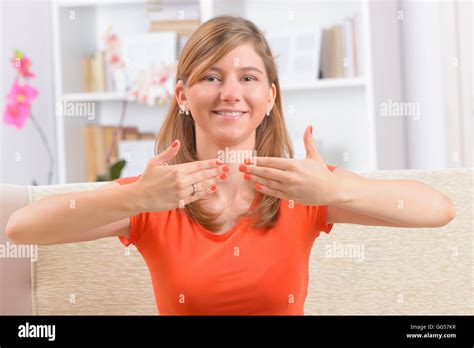 Beautiful Smiling Deaf Woman Using Sign Language Or Showing Ok Sign